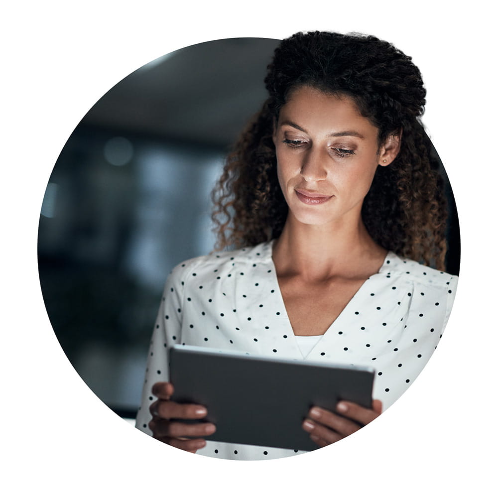 Woman wearing business suit looking at computer screen