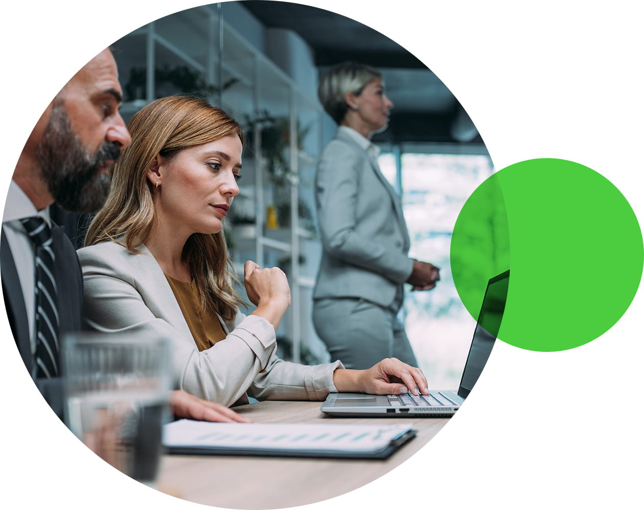 Two office colleagues sit across from one another having a discussion