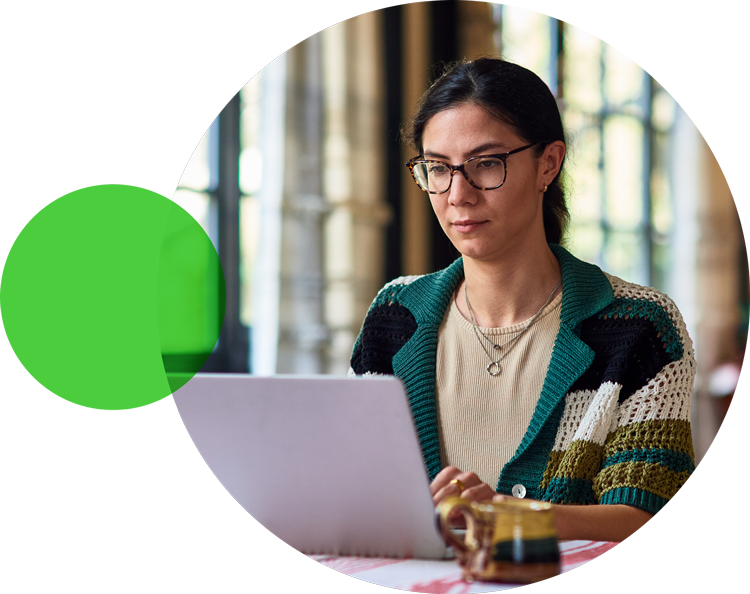 Woman wearing glasses using a laptop